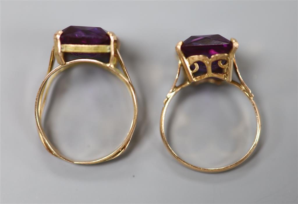 Two 20th century Middle Eastern yellow metal and gem set dress rings, gross 7.6 grams.